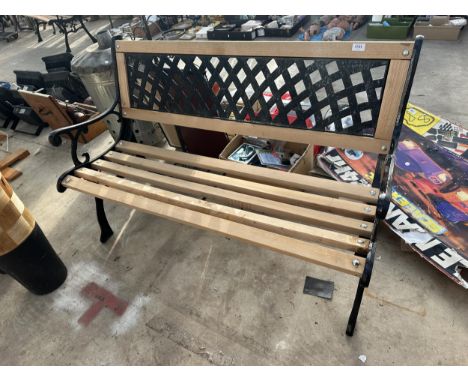 A WOODEN SLATTED GARDEN BENCH WITH CAST BENCH ENDS AND METAL LATTICE BACK 