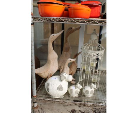 AN ASSORTMENT OF ITEMS TO INCLUDE WOODEN DUCKS, CERAMIC COWS AND A CANDLE LANTERN ETC 