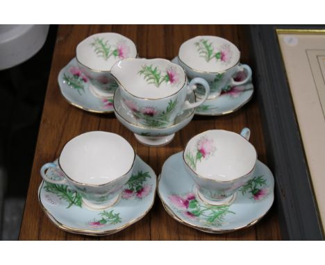 A FOLEY CHINA, 'GLENGARRY THISTLE' PART TEASET TO INCLUDE A SUGAR BOWL, CREAM JUG, CUPS AND SAUCERS 