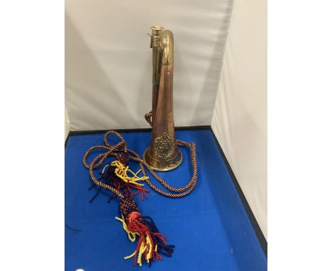 A BRASS AND COPPER 20TH CENTURY BUGLE WITH AN ARGYLE AND SUTHERLAND REGIMENTAL CREST  AND CORD 