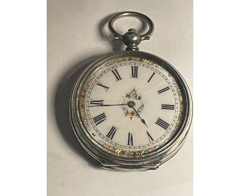 A MARKED 800 SILVER DECORATIVE  LADIES POCKET WATCH WITH INLAID WHITE ENAMEL FACE (A/F) AND ROMAN NUMERALS 