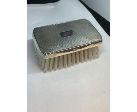 A MARKED STERLING SILVER BRUSH 