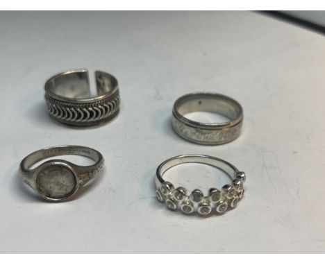 FOUR VARIOUS SILVER RINGS 