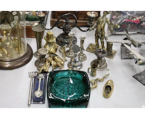 A QUANTITY OF BRASS AND SILVER PLATE TO INCLUDE A HEAVY POACHER FIGURE, CANDLESTICKS, ANIMAL FIGURES, ETC PLUS A LARGE GREEN 