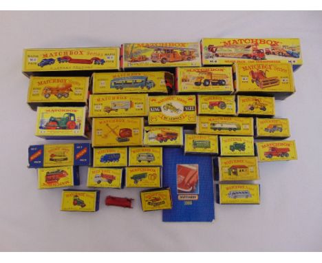 A quantity of Matchbox diecast to include trucks, transporters, farm equipment, diggers and a fire engine, playworn and all i