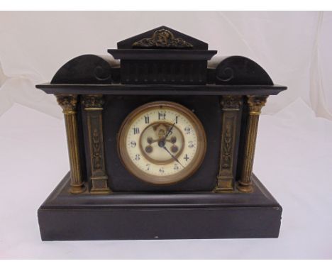 A French black slate mantle clock with white enamel dial and Arabic numerals, two train movement on rectangular plinth