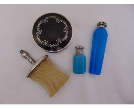 Two blue glass scent bottles with silver repousse tops, largest 13cm long, a silver handled crumb brush and a George V silver