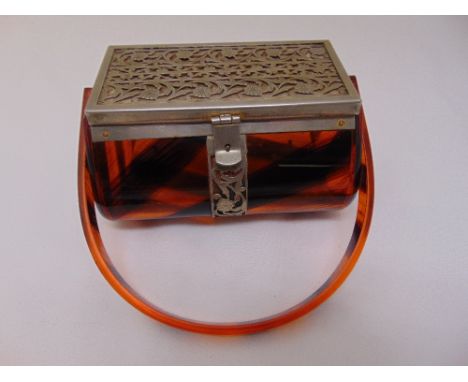 A Lucite and silver plated 1940s ladies handbag, rounded rectangular with swing handle