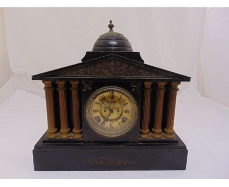 An Ansonia Clock Co. black slate mantle clock, architectural form, gilded dial, Roman numerals, two train movement, on rectan