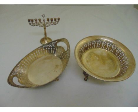 An oval Dutch white metal roll basket, pierced sides with beaded border on four bracket legs, a silver plated continental fru