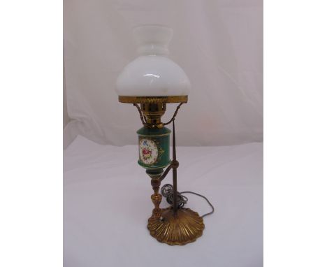 A porcelain and brass table lamp with detachable glass dome