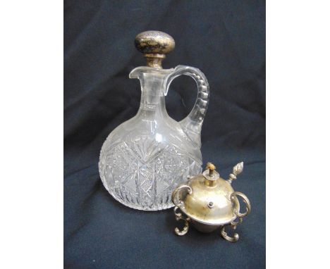 A cut glass ewer with hallmarked silver drop stopper and a silver globular form cigar lamp A/F