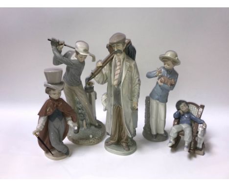 Four Lladro figures and one Nao of a boy holding a puppy