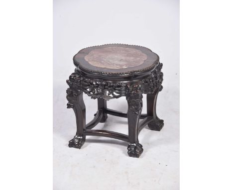A Chinese Huanghauli style jardiniere stand, circa 1900 The central lotus shaped panel with hard wood outer frame and bead wo