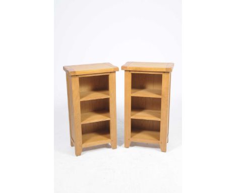 A pair of contemporary light oak open bookcasesEach with a slab top above three fixed shelves, 50x90x30cm.