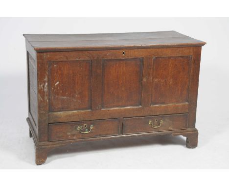 An 18th Century oak mule chestHaving three inverted panels above two lower frieze drawers raised upon bracket feet, 118x80x53