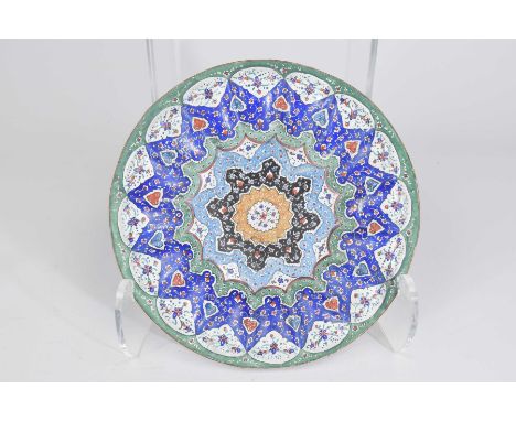 An Indian Jaiphur style enamel dishOf circular form with sloped and lobed sides, the central stylised foliate reserve encircl