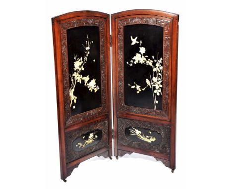 A Japanese shibayama two fold screen, circa 1890 The black lacquered screen inset within framed carved members, detailed with