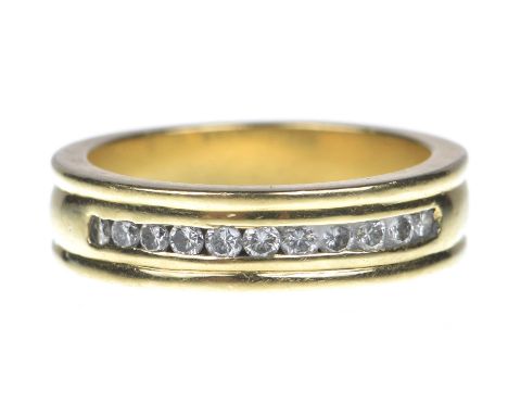 An 18ct gold diamond half eternity ringThe brilliant cut diamond line inset to the grooved band. Estimated diamond weight: 0.
