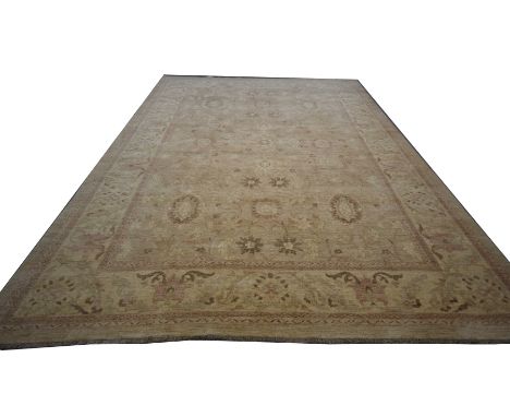 A Ziegler carpetThe ochre and ivory ground rug with large central panel filled with a series of meandering tendrils issuing f