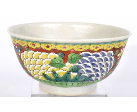 A Chinese red-ground bowl, Chenghua (1464-1487) six character mark Of 'U' form rising from a high foot ring, the red ground d