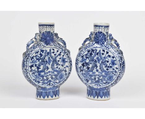 A pair of 19th Century Chinese moon flasks Each of rounded flattened circular form, rising from a high foot ring with under g