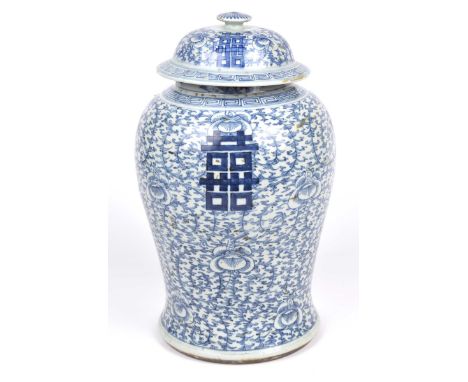 A Chinese blue and white 'marriage jar' and coverOf Meiping form rising from a slightly splayed base adorned with a domed upp