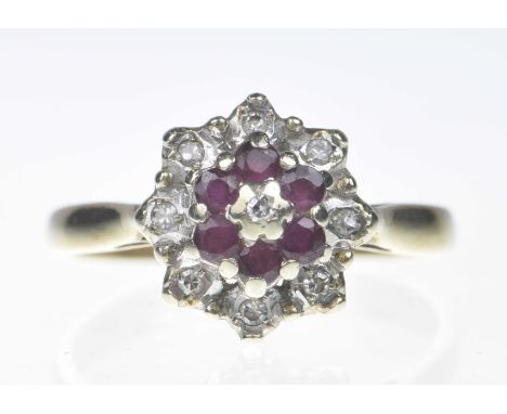 A 9ct gold ruby and diamond cluster ring.Designed as a single-cut diamond and circular shape ruby tiered cluster. Ring size: 