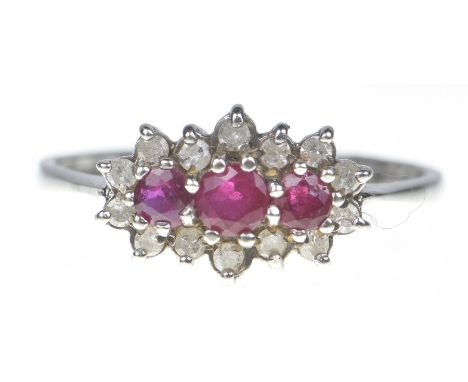 A 9ct gold ruby and diamond dress ringThe oval shape ruby line within a single cut diamond surround. Estimated total diamond 