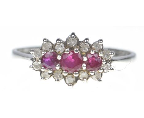 A 9ct gold ruby and diamond dress ringThe oval shape ruby line within a single cut diamond surround. Estimated total diamond 