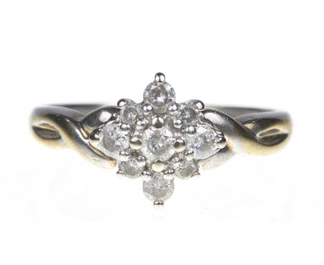 A 9ct gold diamond cluster ringComprising a brilliant cut diamond within a vari-size similarly-cut diamond surround and fancy