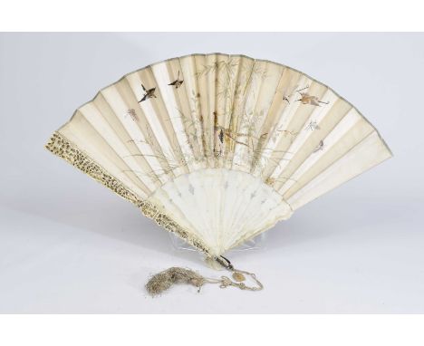 A beautiful Chinese Canton ivory and embroidered fan, late 19th CenturyThe exterior tapered blades carved in high relief with