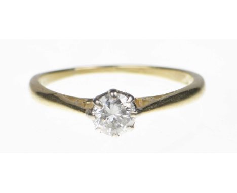 A diamond single stone ringThe brilliant cut diamond within an eight claw setting, and tapered shoulders. Estimated diamond w