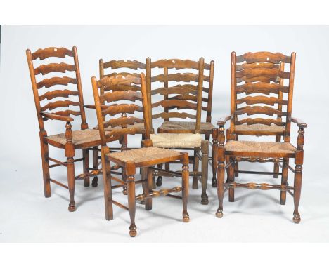 A matched set of seven oak and beechwood country ladder back dining chairsEach chair with shaped rungs above an envelope rush