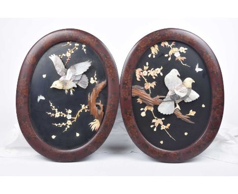 A pair of Japanese shibayama panels, early 20th Century The black lacquered inserts applied with mother of pearl and bone inl