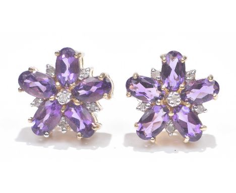 A pair of 9ct gold amethyst and diamond earringsEach designed as a single cut diamond within an oval shape diamond and simila