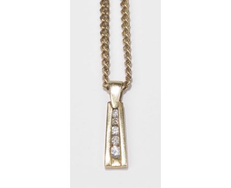 A 9ct gold diamond pendantThe graduated brilliant cut diamond line with tapered sides, suspended from a 9ct gold flat curb li