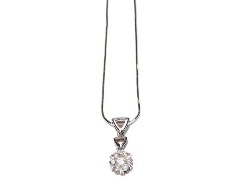 A diamond cluster pendantThe brilliant cut diamond within a similarly cut diamond surround, and triangular shape surmount, su
