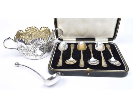 A 1920s cased set of silver tea spoonsTogether with a white metal twin handled cup and ladle, James Deakin & Sons, Sheffield,