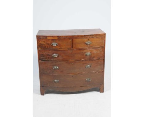 An early 19th Century bow front chest of drawersWith two short and three graduated long drawers each applied with oval backed