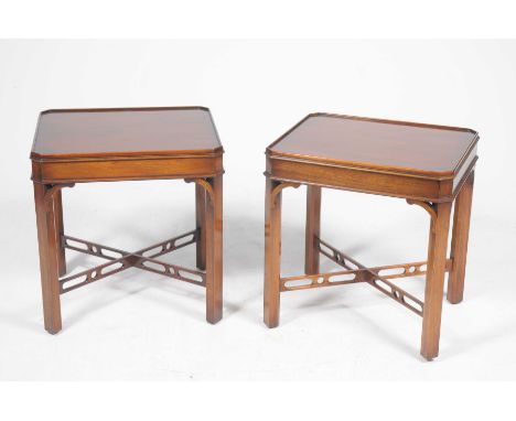 A pair of good quality reproduction mahogany lamp tablesEach table with a rectangular galleried top and canted corners above 