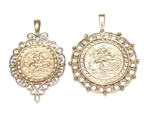 Two 9ct gold pendant mountsEach of a scrolling design, containing a 'St. George' circular shape panel. Total weight approx. 5