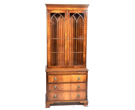 A Reprodux by Bevan Funnell Georgian style mahogany book caseOf small proportions with a dentil moulded cornice above two ast
