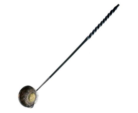 Embossed silver toddy ladle, the bowl inset with a Queen Anne coin, typical twist handle, hallmarks indistinct   Condition: 