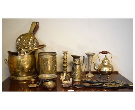 Group of assorted brass wares to include; coal helmet, bellows, pair of candlesticks, martingales, Eastern wares etc   Condit