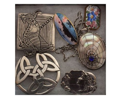Sterling silver pendant of oval form decorated in mother-of-pearl with a spiders web with blue paste centre, stamped Sterling