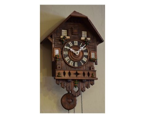 Black Forest type stained pine and beech cased cuckoo clock   Condition: 