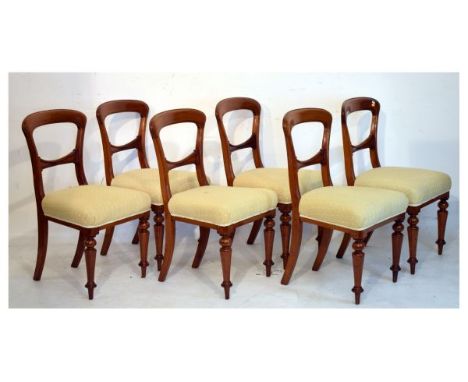 Set of six Victorian mahogany buckle back dining chairs, each having a stuffed seat upholstered in light brown and cream fabr