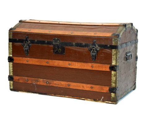 Early 20th Century dome-topped canvas trunk with wooden strips and metal mounts   Condition: 
