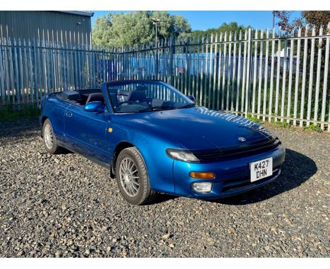Fitted with electric folding hood, rear wheel steer and Factory tonneau cover.Finished in metallic blue with blue convertible